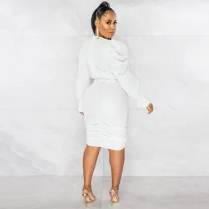 Detailed back view of a stylish white long sleeve ruched V-neck dress for women.