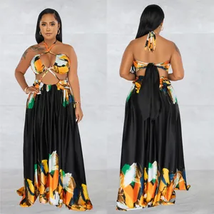Front and back view of a vibrant color block halter wrap top and maxi skirt set