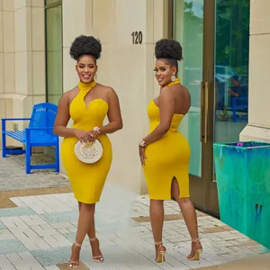 Front and side view of a vibrant yellow halter neck bodycon midi dress for women