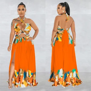 Vibrant orange halter neck cutout maxi dress with abstract print and high leg slit