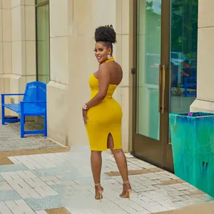 Elegant yellow halter neck sleeveless bodycon midi dress with back slit