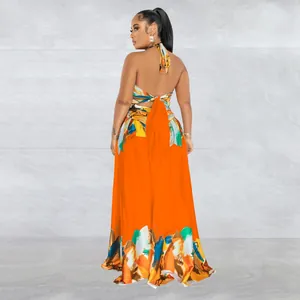 Back view of vibrant orange halter neck maxi dress with contrast floral print