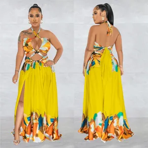Vibrant yellow halter neck cut-out maxi dress featuring a bold floral print and high slit
