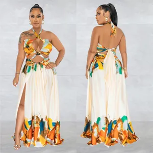 Front and back view of a colorful halter neck maxi dress with a thigh-high slit