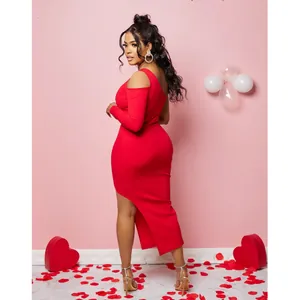 Full body shot of a model wearing a red one-shoulder slit dress in a romantic set