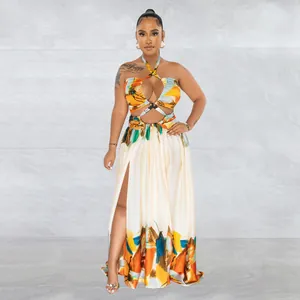 Tropical print halter maxi dress with elegant waist cut-out and thigh-high slit detail