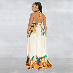 Back view of women's colorful abstract print halter neck backless maxi dress.