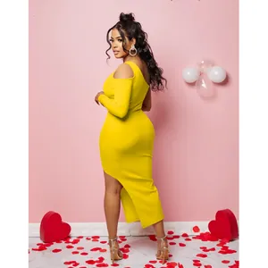Detailed view of the asymmetrical hemline and fit of this yellow one-shoulder maxi dress