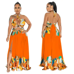Detailed view of back and side slit on vibrant orange halter maxi dress