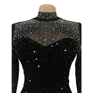Close-up of elegant rhinestone and sequin detailing on a black mesh party dress