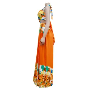 Side view of orange floral print sleeveless maxi dress with tie-up back details