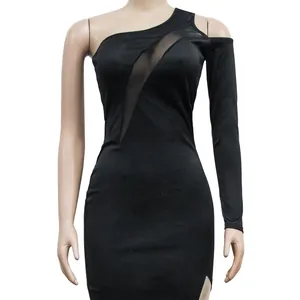 Detail view of an elegant black one-shoulder dress with mesh panel and single long sleeve