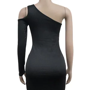 Detailed rear view of elegant black shimmering one-shoulder dress with textured fabric