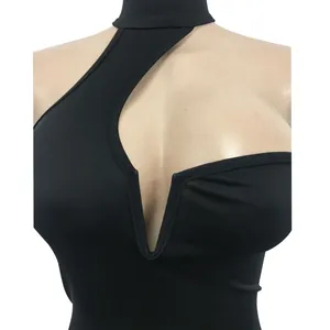 Detail showing the sexy chest cut-out and halter neck design of a black sleeveless dress