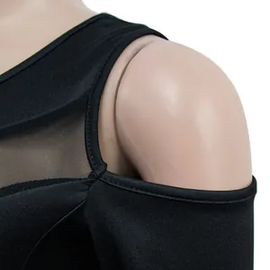 Close-up detail of cold-shoulder dress with black mesh panel and fine stitching finish.
