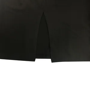Close-up detail of the hemline slit on a black sleeveless fashion dress for women.