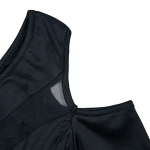 Detailed macro view of black one-shoulder dress showing mesh stitching and fabric texture