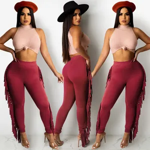 Two-piece fashion set with sleeveless ribbed crop top and burgundy fringe leggings