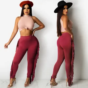 Women's 2-piece set with pink ribbed sleeveless crop top and burgundy fringe leggings