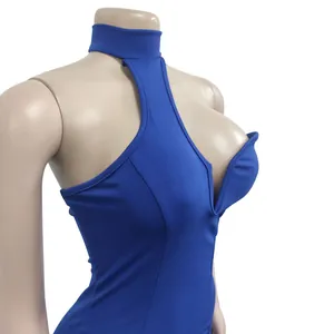 Close-up detail of a blue sleeveless halter neck dress with a sexy plunging neckline cut