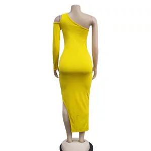 Back view of yellow one-shoulder maxi dress with single long sleeve and high side slit