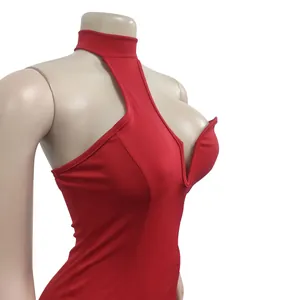 Detail of red halter neck dress with deep V-neck and cut-out chest design on mannequin