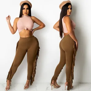 Detailed front and side view of women's pink ribbed crop top and brown fringe leggings set