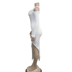 Side profile of a white asymmetrical mesh dress with one long sleeve on a mannequin.