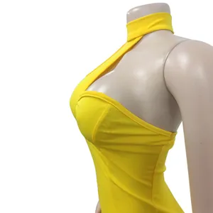 Detailed close-up shot of a yellow halter neck tube top sleeveless dress on a mannequin.