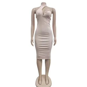 Detailed shot of a light pink halter neck bodycon dress featuring a deep V-neck cutout design