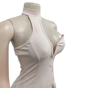 Macro view showing the halter neck and deep V-plunge detail of a pink bodycon dress