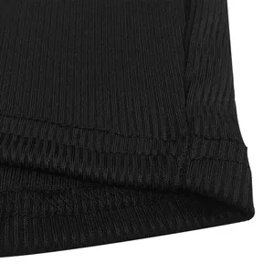 Detailed close-up of the black ribbed fabric hem showing double-stitch quality