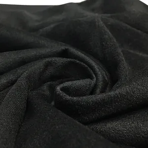 Macro view of soft black fabric texture for casual sleeveless vest and trousers set