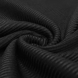 Macro detail of the soft black ribbed knit fabric of the fashion casual two-piece set