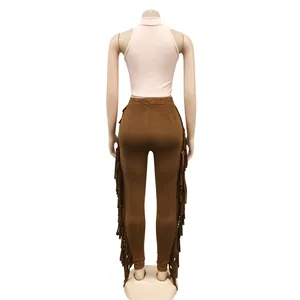 Back view of a stylish pink sleeveless tank top and brown fringe-trimmed long pants set