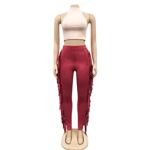 Detail view of two-piece set featuring side fringe leggings and sleeveless crop top.