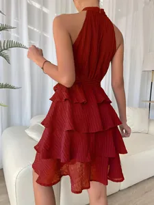 Detailed back view of a burgundy sleeveless halter neck dress with layered ruffles