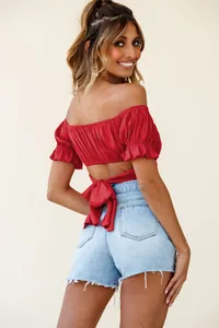 Detailed back view of sexy red off-shoulder crop top with tie-back and ruffle sleeves