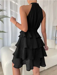 Back view of a black sleeveless halter mini dress featuring elegant tiered ruffles
