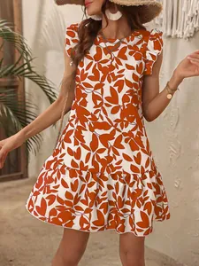 Detail view of a floral print mini dress with ruffle sleeves and round neck.