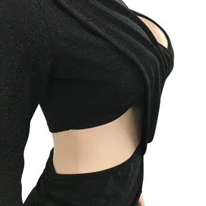 Close-up of black glitter long sleeve dress featuring a sexy side waist cutout design.
