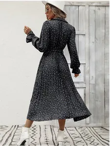Elegant black floral pleated maxi dress with long sleeves and a matching waist tie