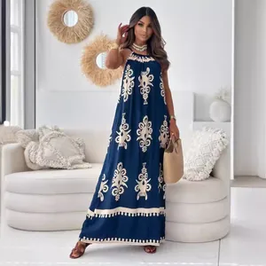 Elegant navy blue halter maxi dress featuring white ornamental print and backless design