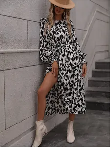 Close-up detail view of stylish leopard print long sleeve dress with a belted waist design.