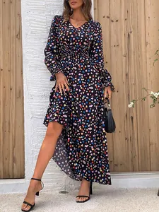 Detail of women's long sleeve V-neck maxi dress with vibrant multicolored heart print