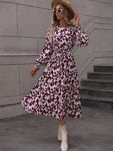 Elegant burgundy leopard print maxi dress featuring tie-waist and smocked cuffs detail