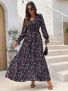 Full-length view of a V-neck long sleeve maxi dress featuring colorful heart prints.