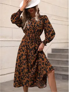 Elegant leopard print long sleeve maxi dress with waist tie for autumn and winter style.