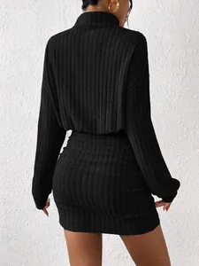 Detailed back view of a black ribbed turtleneck bodycon long-sleeved dress for autumn