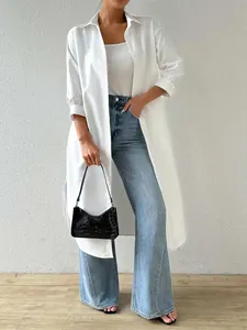 Stylish white long cardigan shirt paired with high-waisted flared blue jeans